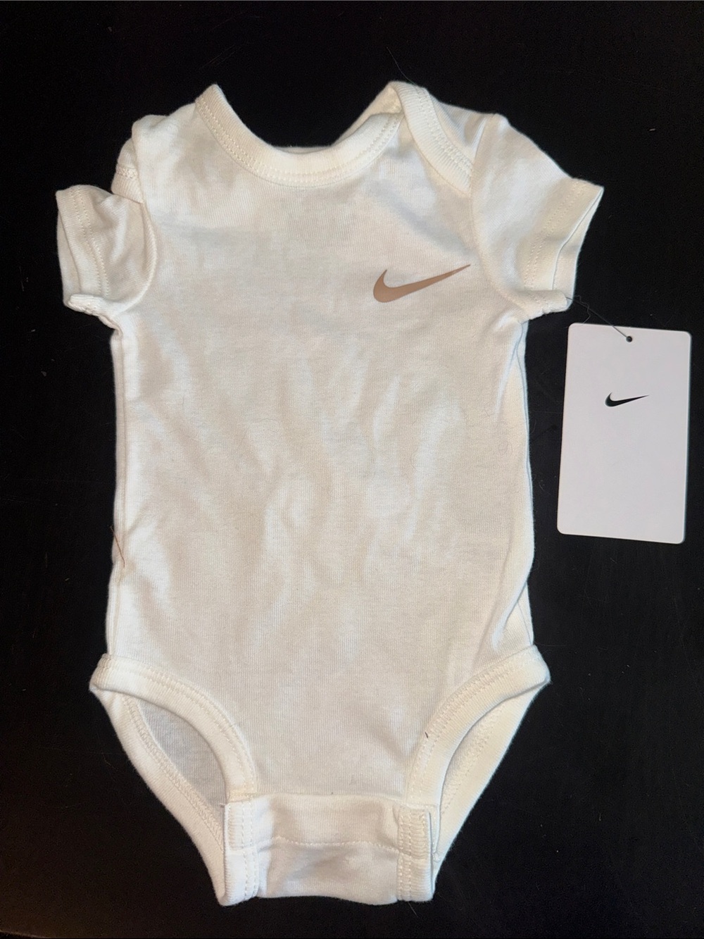 Nike White Infant One-Piece Bodysuit with Metallic Swoosh